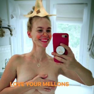 January Jones Shooting Her Covering Mellons In The Mirror