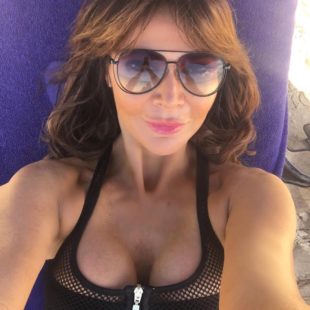 Lizzie Cundy Deep Cleavage And Swimsuit Photos